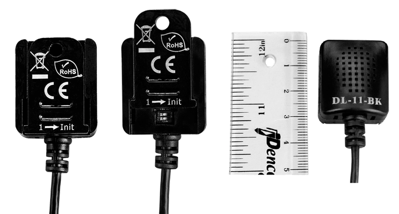 Три черных датчика с маркировкой RoHS и CE, расположенные рядом с белой линейкой для измерения. Один из датчиков с надписью DL-11-BK, линейка показывает размер в сантиметрах до 5 см
